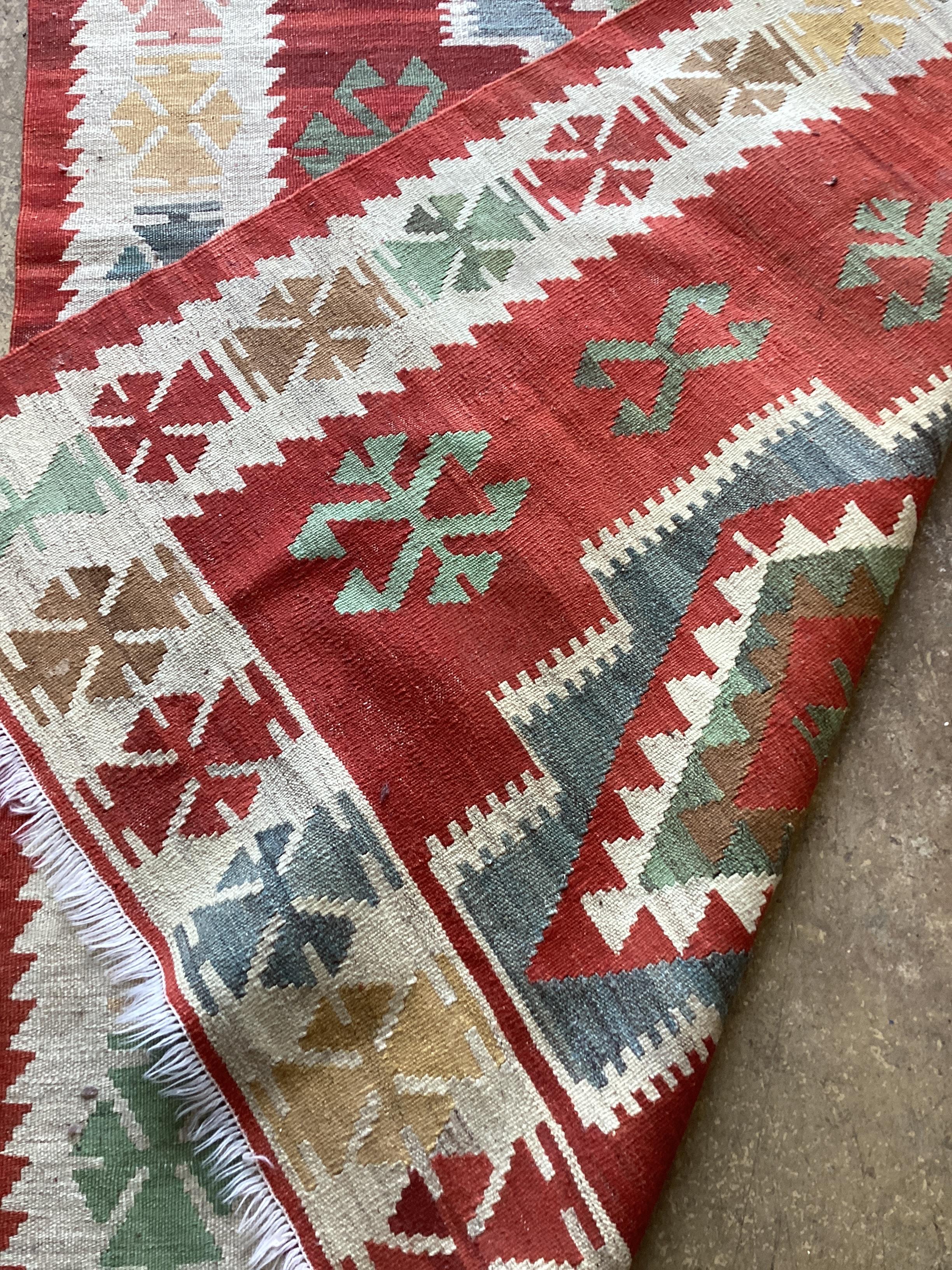 A Kilim polychrome geometric rug, 194 x 129cm